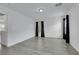 Neutral bedroom with grey flooring, black curtains, and minimalist design with light walls at 7222 Liberty Pride St, Las Vegas, NV 89148