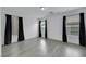 Bright bedroom with multiple windows bringing in lots of natural light and grey wood-look flooring at 7222 Liberty Pride St, Las Vegas, NV 89148