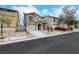 Inviting two-story home with a private balcony, attached garage, and neatly maintained front yard landscaping at 7222 Liberty Pride St, Las Vegas, NV 89148