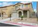 Inviting two-story home with desert landscaping, balcony, and convenient attached garage at 7222 Liberty Pride St, Las Vegas, NV 89148