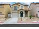 Charming two-story home featuring a balcony, attached garage, and desert landscaping at 7222 Liberty Pride St, Las Vegas, NV 89148