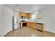 Bright kitchen features stainless steel appliances, wood cabinets, and tile flooring at 7222 Liberty Pride St, Las Vegas, NV 89148