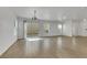 Bright living space featuring wood look floors and sliding glass doors at 7222 Liberty Pride St, Las Vegas, NV 89148