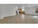 Spacious living room with stairs, light colored walls and wood look floors at 7222 Liberty Pride St, Las Vegas, NV 89148
