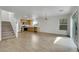 Living space and kitchen featuring stainless steel appliances, wood cabinets, and tile floors at 7222 Liberty Pride St, Las Vegas, NV 89148