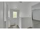 Well-lit stairway and landing with wood-look floors and fresh paint at 7222 Liberty Pride St, Las Vegas, NV 89148
