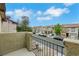 Balcony view showcasing the neighborhood's well-maintained street and charming homes under a bright sky at 7222 Liberty Pride St, Las Vegas, NV 89148