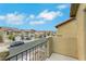 Balcony view showcasing the neighborhood's well-maintained street and charming homes under a bright sky at 7222 Liberty Pride St, Las Vegas, NV 89148