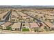 Community aerial view showcases lush lawns, hardscape, and many homes with solar panels at 732 Rosewater Dr, Henderson, NV 89011