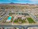 Aerial shot of community with pool, tennis courts, common areas, and proximity to mountains at 732 Rosewater Dr, Henderson, NV 89011