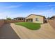 This backyard features a grass lawn area, gravel ground, and a perimeter brick wall at 732 Rosewater Dr, Henderson, NV 89011