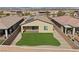 A well-maintained backyard featuring fresh sod, a patio, and block wall landscaping for added privacy at 732 Rosewater Dr, Henderson, NV 89011