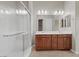 Bright bathroom featuring a glass shower, double vanity, and tiled floor at 732 Rosewater Dr, Henderson, NV 89011
