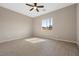 Serene bedroom featuring neutral walls, ceiling fan, and a sun-filled window at 732 Rosewater Dr, Henderson, NV 89011
