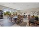 Dining room with many black tables, wooden chairs, overhead lighting, and large windows at 732 Rosewater Dr, Henderson, NV 89011