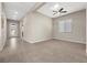 Hallway with tile floors, window with blinds, ceiling fan, and doorways at 732 Rosewater Dr, Henderson, NV 89011