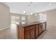 Spacious kitchen featuring an expansive island and seamless flow to the well-lit living area at 732 Rosewater Dr, Henderson, NV 89011