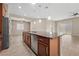 Kitchen island and appliances with an open floor plan connecting to dining and living areas at 732 Rosewater Dr, Henderson, NV 89011
