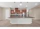 Open-concept kitchen featuring a large island with sink and stainless steel appliances at 732 Rosewater Dr, Henderson, NV 89011