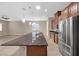 Kitchen with a large island, stainless steel appliances, and seamless transition to the living area at 732 Rosewater Dr, Henderson, NV 89011