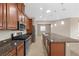 Charming kitchen features stainless steel appliances, a spacious island, and plenty of cabinet space at 732 Rosewater Dr, Henderson, NV 89011