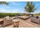 Relaxing outdoor seating area with a brick fire pit and well-manicured landscaping at 732 Rosewater Dr, Henderson, NV 89011