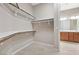 Walk-in closet featuring wood shelving and tile flooring at 732 Rosewater Dr, Henderson, NV 89011