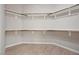 Walk-in closet featuring wood shelving and tile flooring at 732 Rosewater Dr, Henderson, NV 89011