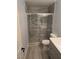 Updated bathroom features a walk-in shower with decorative tile and river rock floor at 8455 W Sahara Ave # 258, Las Vegas, NV 89117
