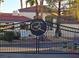 View of the community entrance gate, showcasing a landscaped entrance to the homes beyond the security at 8455 W Sahara Ave # 258, Las Vegas, NV 89117
