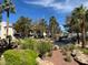 Exterior of complex with landscaping and palm trees at 8455 W Sahara Ave # 258, Las Vegas, NV 89117