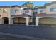 Exterior of condo building with covered parking, showcasing the architectural style and convenient parking at 8455 W Sahara Ave # 258, Las Vegas, NV 89117