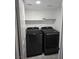Laundry room with black washer and dryer at 8455 W Sahara Ave # 258, Las Vegas, NV 89117