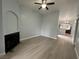Living room showcasing laminate flooring and a fireplace with views to the kitchen at 8455 W Sahara Ave # 258, Las Vegas, NV 89117