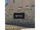 Stone entrance sign indicating the 'Upton' community, adding a touch of exclusivity to the neighborhood at 9070 Rivington Ave, Las Vegas, NV 89148