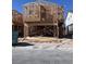 New construction home shows the framing with wooden beams in a modern design at 9070 Rivington Ave, Las Vegas, NV 89148