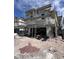 New construction home featuring scaffolding and a modern architectural design under a sunny sky at 9070 Rivington Ave, Las Vegas, NV 89148