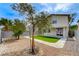 Large backyard featuring low maintenance landscaping, including an artificial turf area at 9264 Ansley Ct, Las Vegas, NV 89148