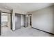 View of a bedroom with sliding closet doors and neutral carpeting throughout at 9264 Ansley Ct, Las Vegas, NV 89148