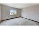 Spacious bedroom featuring a window with blinds and neutral wall-to-wall carpet at 9264 Ansley Ct, Las Vegas, NV 89148