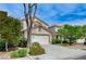 A charming two-story house with well-maintained landscaping is nestled in a quiet neighborhood at 9264 Ansley Ct, Las Vegas, NV 89148