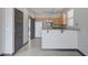 Kitchen with granite countertops, wood cabinets, and modern appliances at 9264 Ansley Ct, Las Vegas, NV 89148