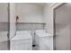 Convenient laundry room with washer, dryer, and shelf storage for cleaning supplies at 9264 Ansley Ct, Las Vegas, NV 89148