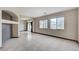Spacious living room with tile floors and bright natural light shining through the windows at 9264 Ansley Ct, Las Vegas, NV 89148
