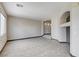 Inviting living room with neutral paint, tile floors, and views into other living spaces at 9264 Ansley Ct, Las Vegas, NV 89148