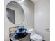 Chic powder room with vessel sink, granite counter, and stylish faucet at 9264 Ansley Ct, Las Vegas, NV 89148
