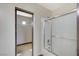 Bathroom featuring a shower with glass doors and view into the walk-in closet at 9264 Ansley Ct, Las Vegas, NV 89148
