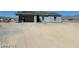 Unfinished single-story home exterior featuring block construction and an expansive lot at 970 Mount Charleston Dr, Pahrump, NV 89048