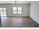 Spacious living room with laminate flooring and natural lighting at 970 Mount Charleston Dr, Pahrump, NV 89048
