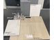 Upgraded bath finishings include vinyl plank, quartz countertop, and stylish chrome faucets at 9989 River Corral St, Las Vegas, NV 89166
